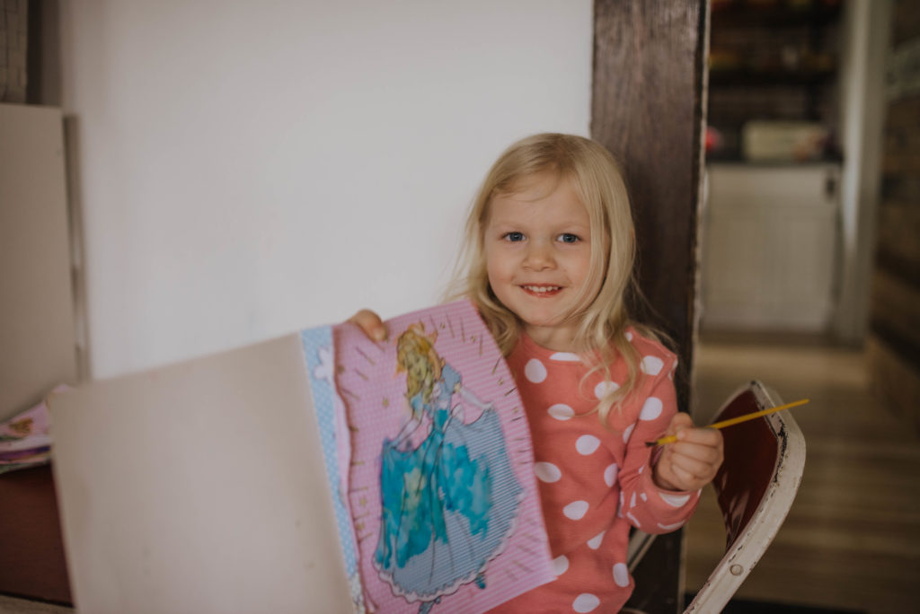 girl showing a painted picture
